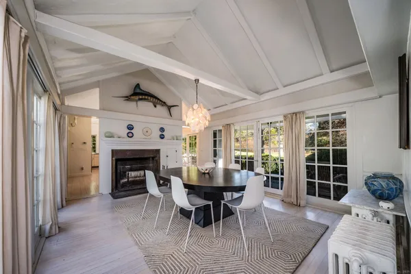 a view of a livingroom with furniture and a fireplace