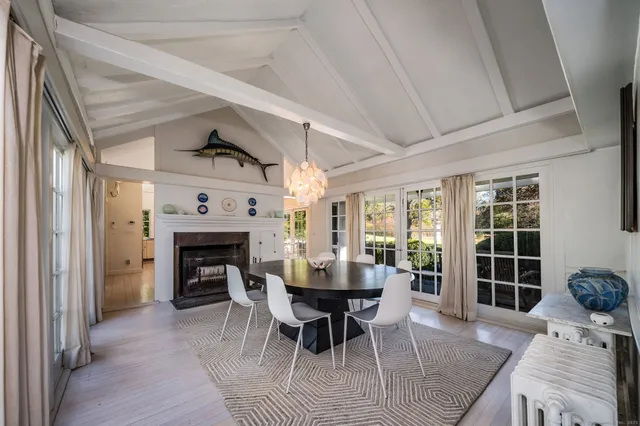a view of a livingroom with furniture and a fireplace