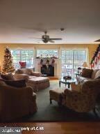 25 Tournament Way Hazleton, PA 18202 - Photo 10 of 66 Living room with propane fireplace and wall of win