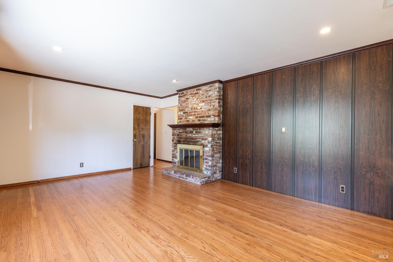 2236 West Hearn Avenue Santa Rosa, CA 95407 - Photo 11 of 56 a view of an empty room with wooden floor and a window