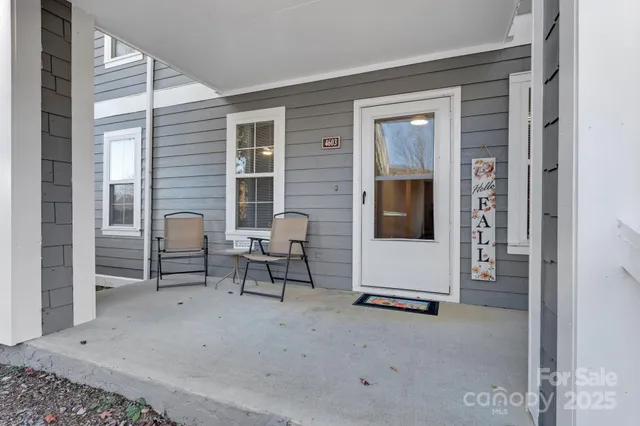 a view of a livingroom with furniture and windows