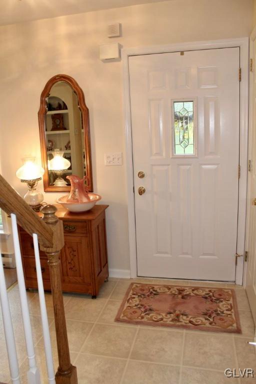 6043 Running Valley Road Stroudsburg, PA 18360 - Photo 11 of 43 a view of a hallway with wooden floor and a living room