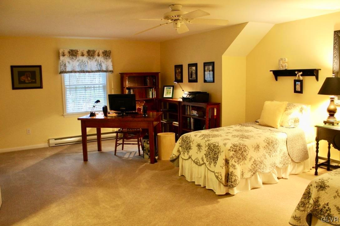 6043 Running Valley Road Stroudsburg, PA 18360 - Photo 16 of 43 a bed room with a bed and a chair
