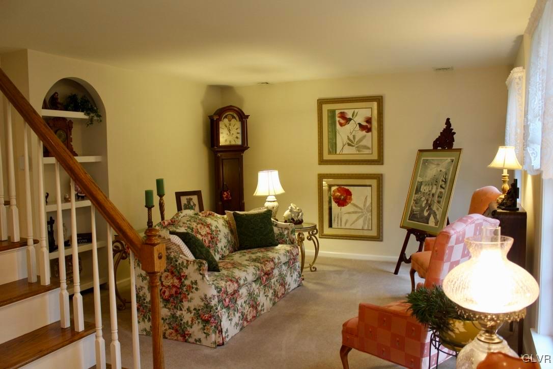 6043 Running Valley Road Stroudsburg, PA 18360 - Photo 23 of 43 a living room with furniture a rug and a painting