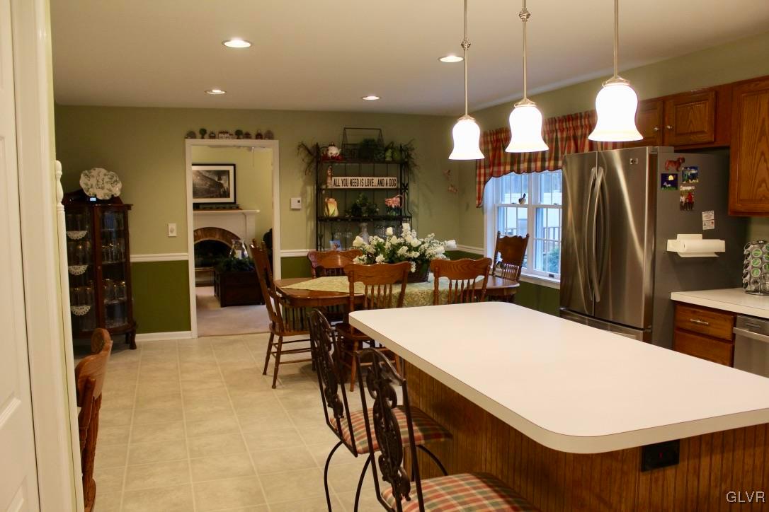 6043 Running Valley Road Stroudsburg, PA 18360 - Photo 26 of 43 a large kitchen with a table and chairs