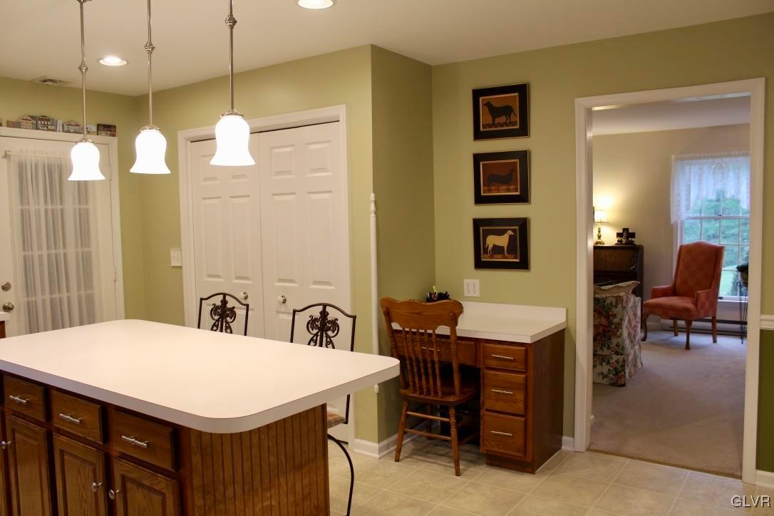 6043 Running Valley Road Stroudsburg, PA 18360 - Photo 29 of 43 a room with a table chairs and a kitchen