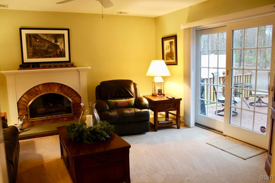 6043 Running Valley Road Stroudsburg, PA 18360 - Photo 31 of 43 a living room with furniture and a fireplace
