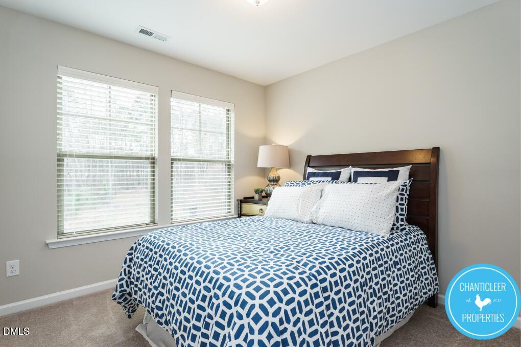 1119 Midtowne Way Durham, NC 27713 - Photo 19 of 26 a bedroom with a bed and window
