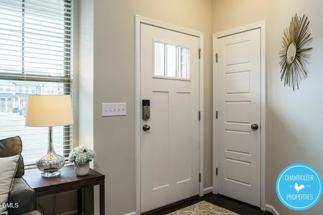 a view of an entryway with wooden floor