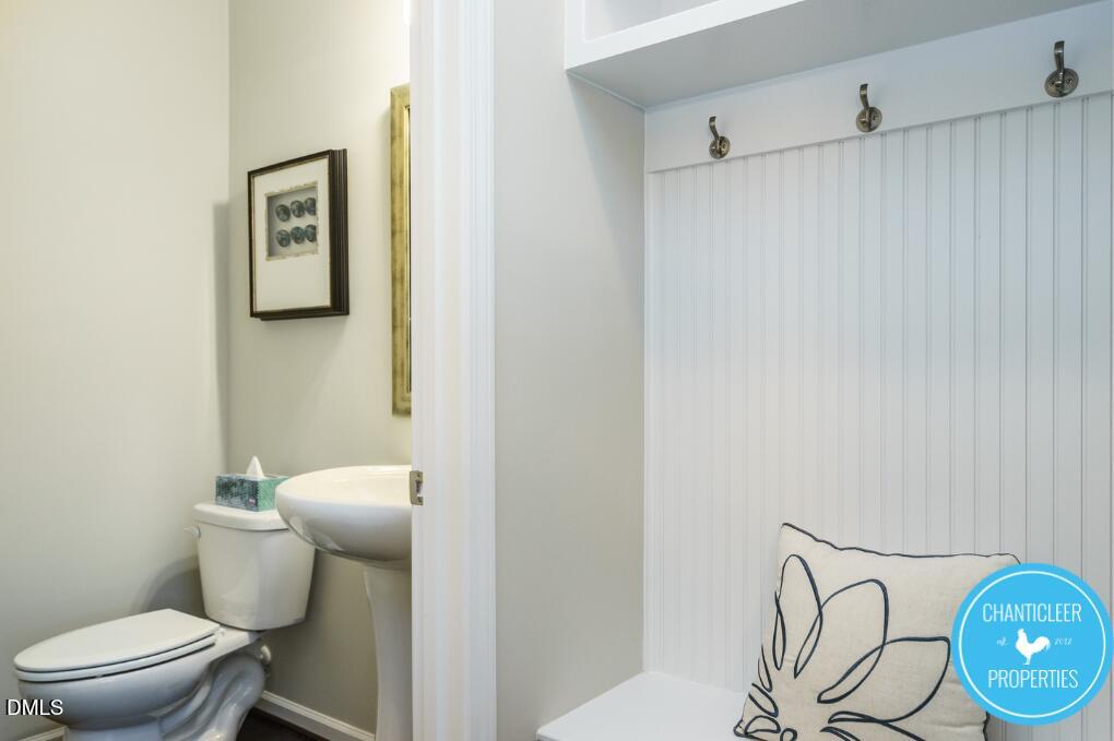 1119 Midtowne Way Durham, NC 27713 - Photo 22 of 26 a white toilet sitting next to a shower curtain