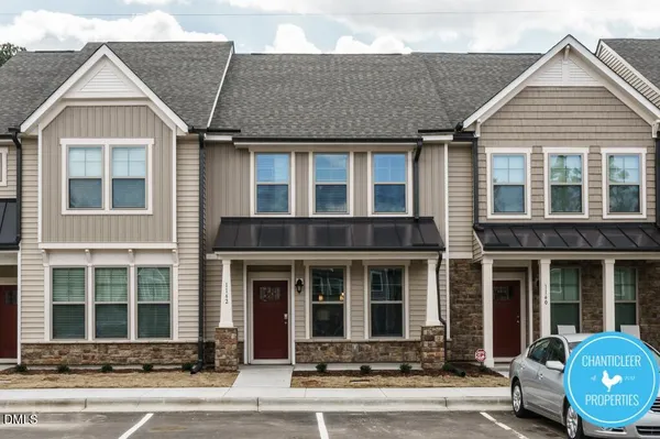 front view of a brick house with a outdoor space