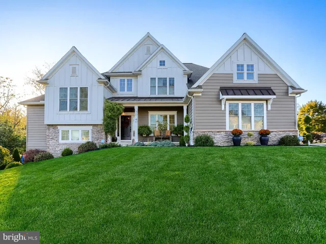 a front view of a house with a yard and porch