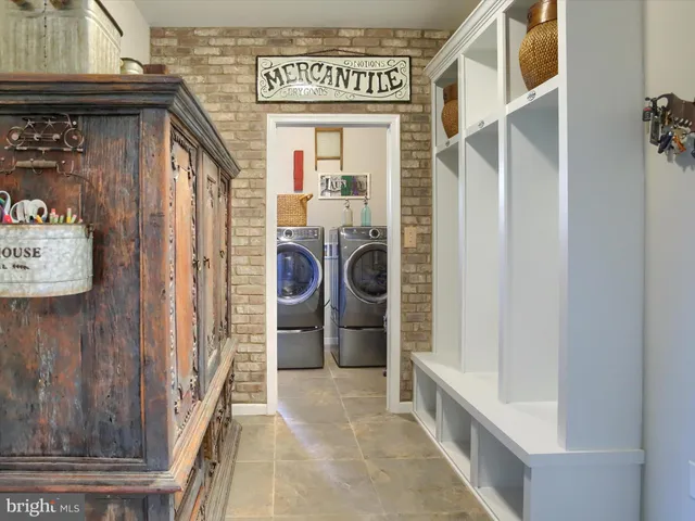 a view of walk in closet with clothes