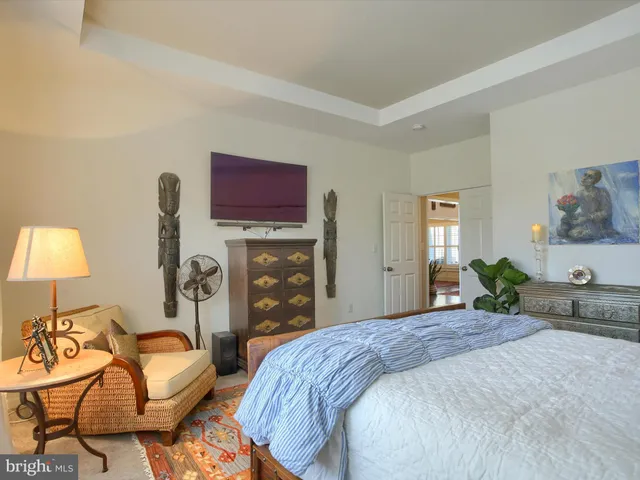 a bathroom with a sink a toilet and a window