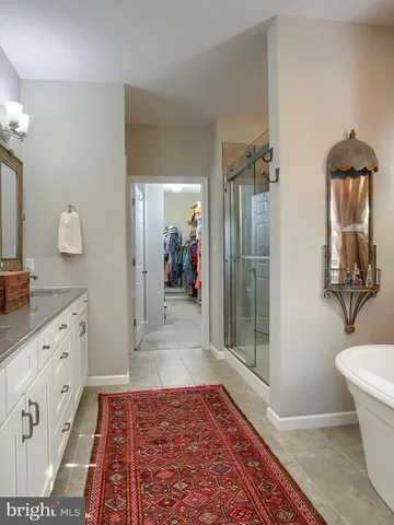 a view of a hallway with paintings on the wall