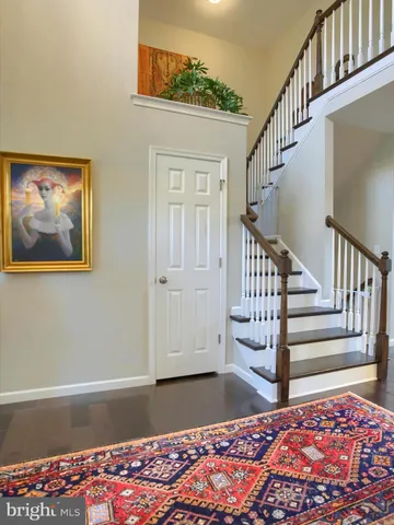 a front view of a house with a yard table and chairs