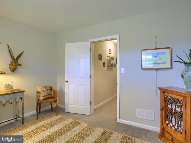 a view of a house with backyard sitting area and sitting area