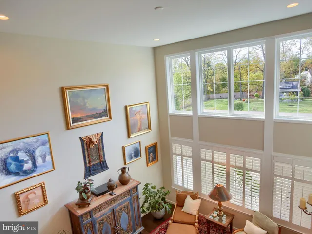 a view of a patio with table and chairs with wooden floor and fence