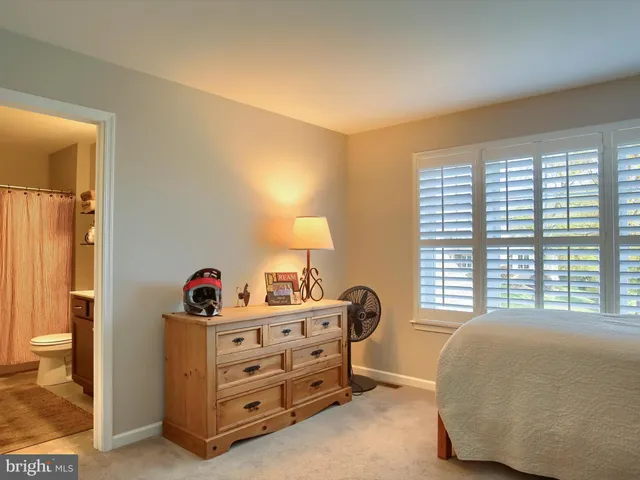 a view of a back yard with a chair and table