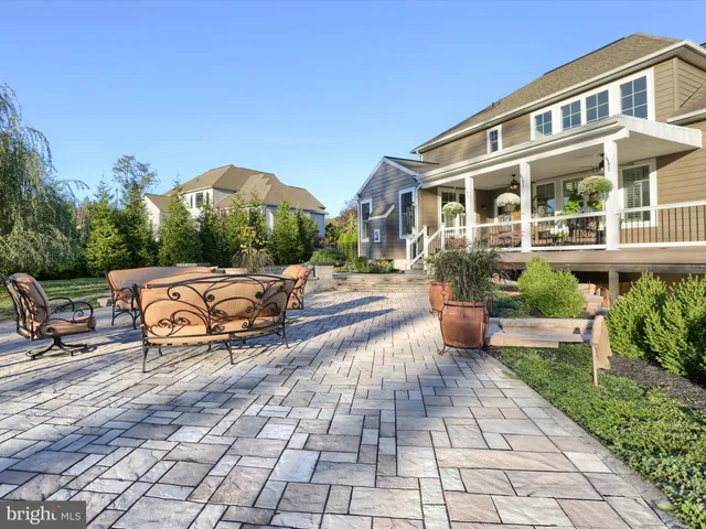 a view of yard with swimming pool and trees