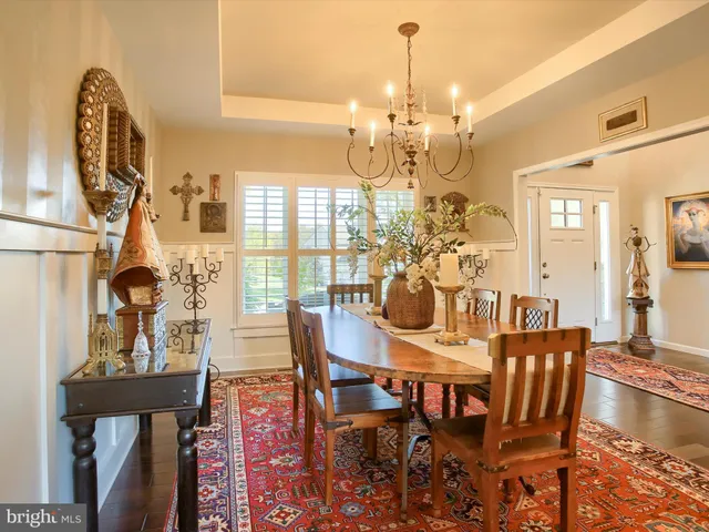 a large kitchen with lots of counter space wooden floor and appliances