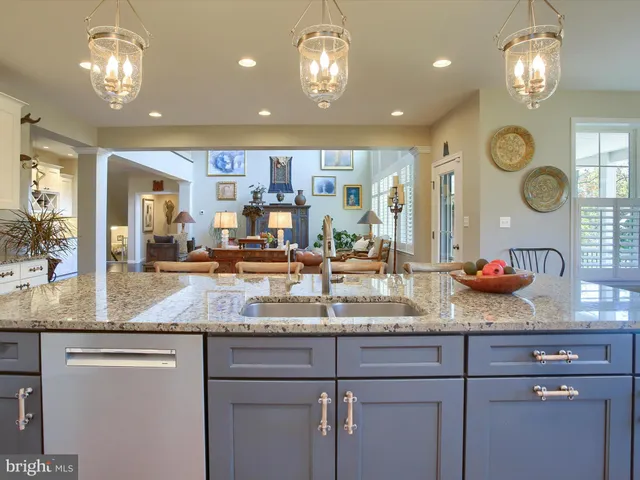 a dining room with furniture a fireplace and wooden floor