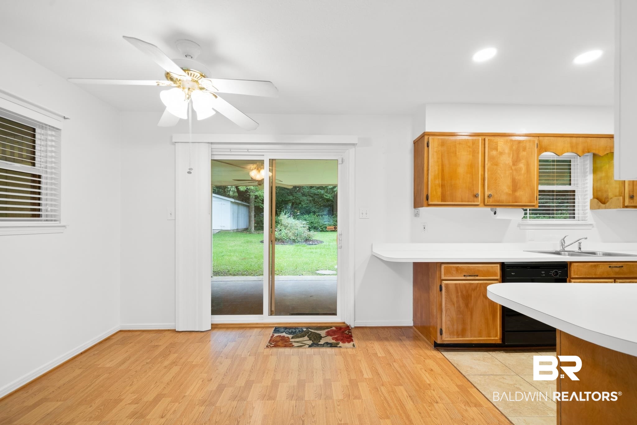 280 Thrift Street Mobile, AL 36609 - Photo 6 of 22 Kitchen featuring dishwasher, light hardwood / wood-style flooring, and a wealth of natural light