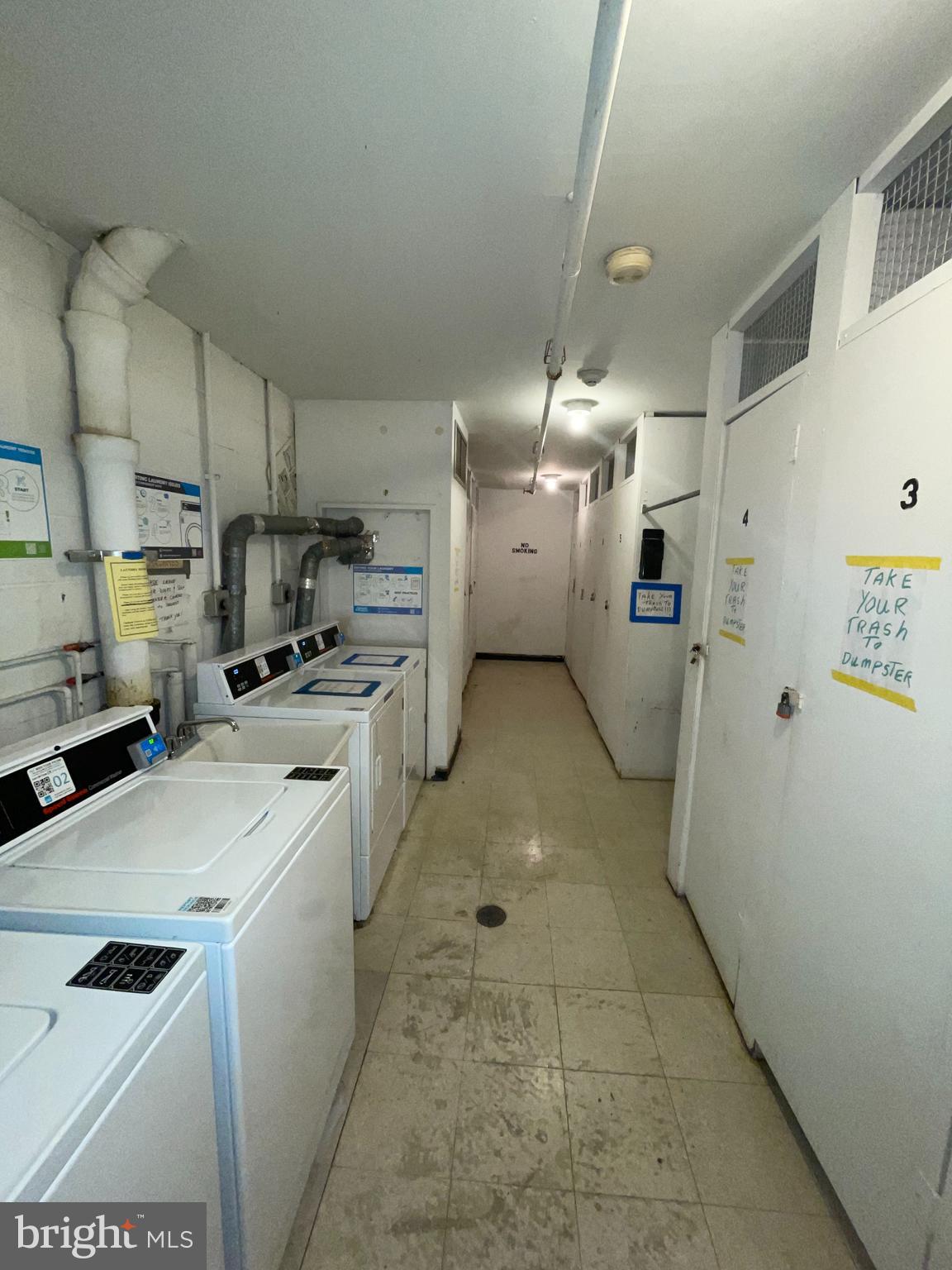 7600 Roosevelt Boulevard, Unit 904 Philadelphia, PA 19152 - Photo 18 of 23 a kitchen with cabinets and white appliances