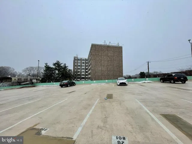 a view of a parking space in front of a building