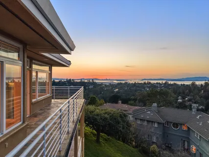 a view of a balcony with city view
