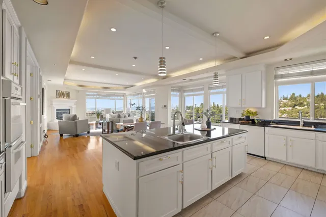 a living room with furniture a fireplace and a table