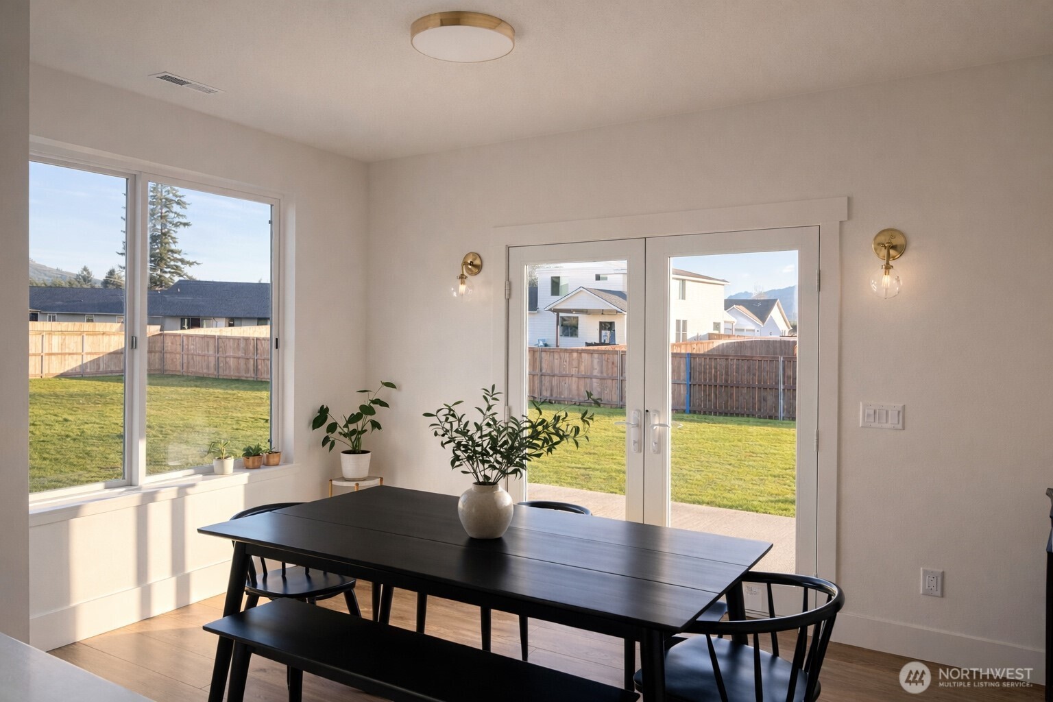 639 Vertex Avenue Winlock, WA 98596 - Photo 7 of 22 a view of a dining room with furniture and a potted plant