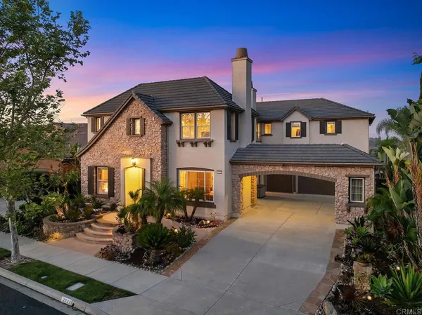 a front view of a house with yard