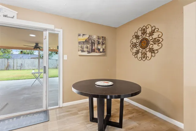 a view of a hallway with a dining area