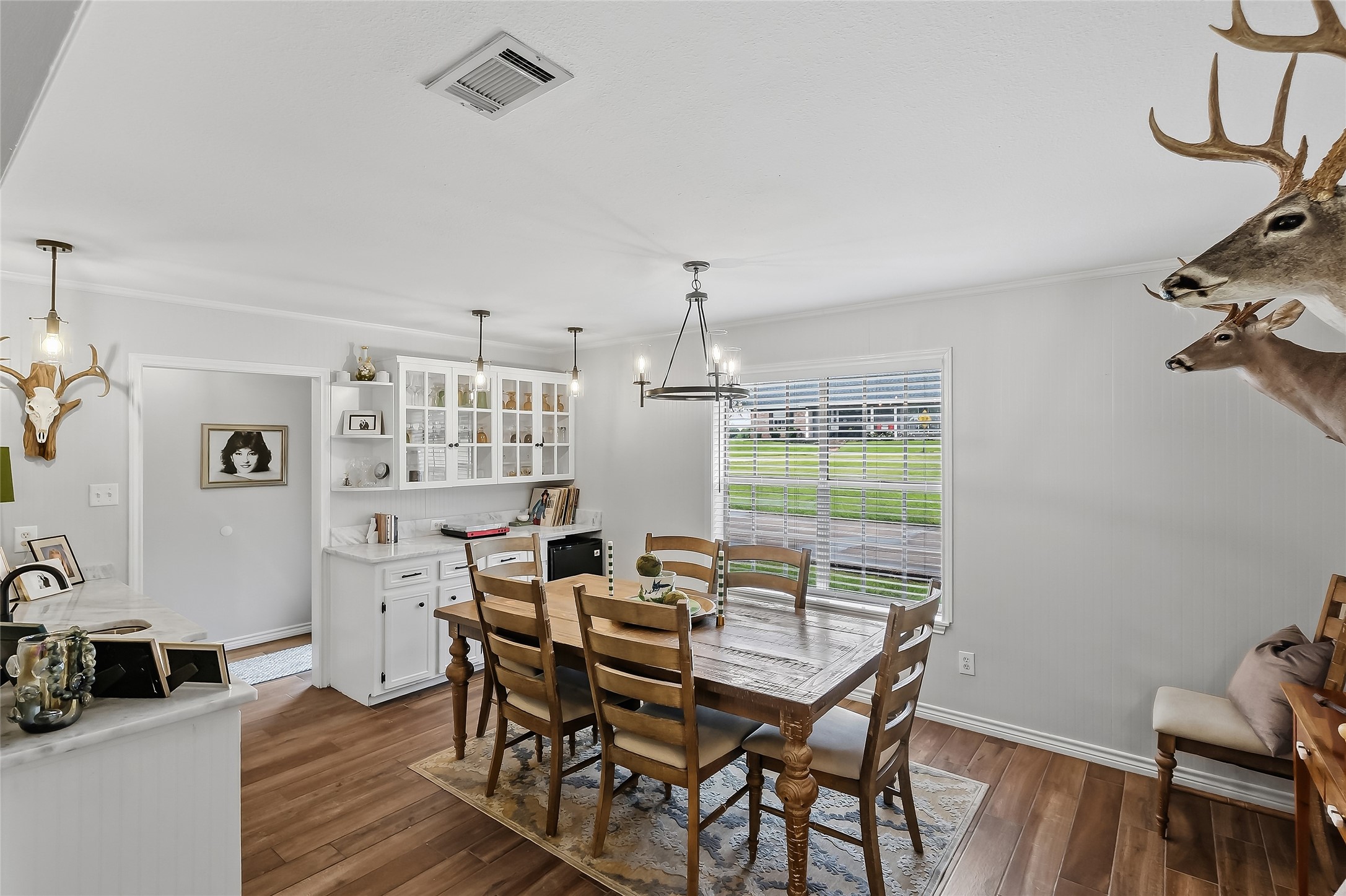 906 Standley Road Madisonville, TX 77864 - Photo 10 of 40 a view of a dining room with furniture window and wooden floor