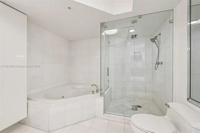 a bathroom with a shower and a tub