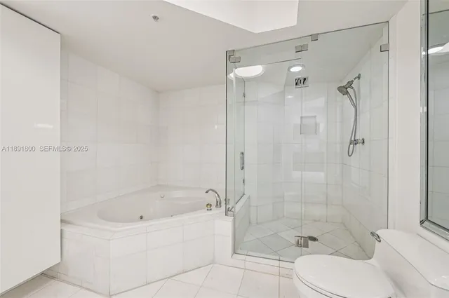 a bathroom with a shower and a tub