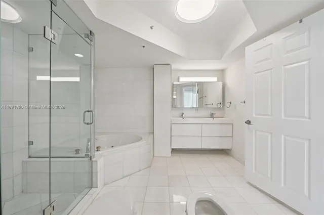 a bathroom with a sink and mirror