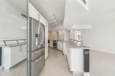 a view of a kitchen with electric appliances