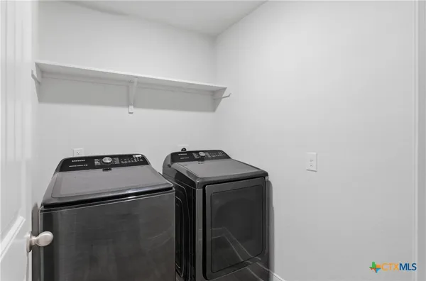 a utility room with dryer and washer