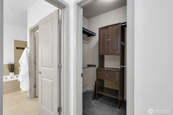 a view of bathroom with a sink and mirror
