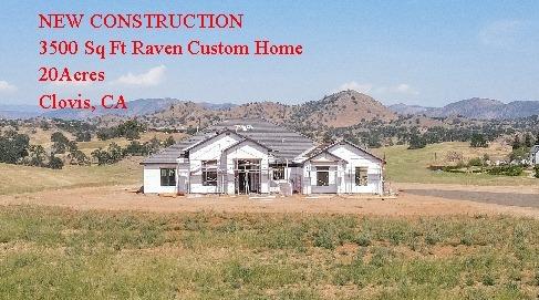 a view of residential houses with an ocean view