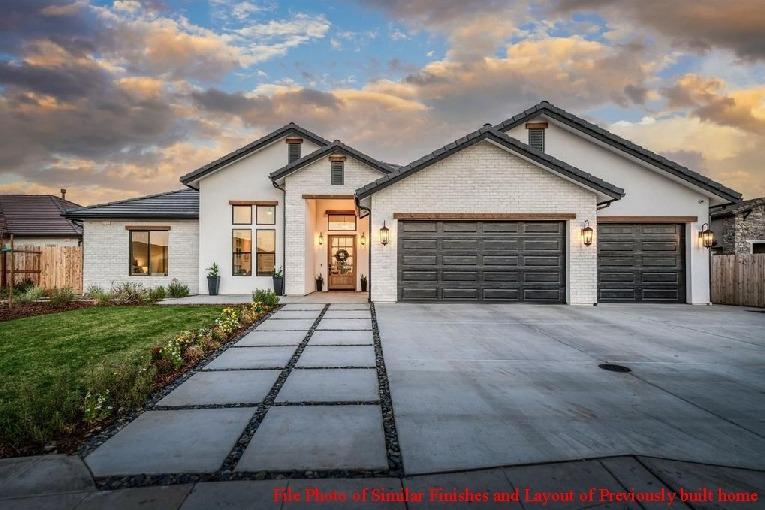 14480 Academy Oaks Lane Clovis, CA 93619 - Photo 12 of 37 a front view of a house with yard