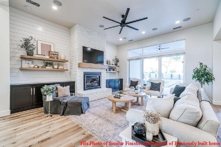 14480 Academy Oaks Lane Clovis, CA 93619 - Photo 14 of 37 a living room with furniture a fireplace and a flat screen tv