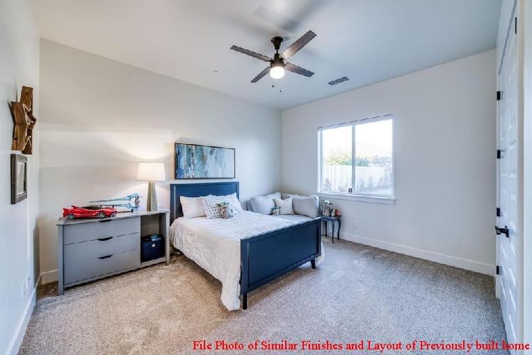 14480 Academy Oaks Lane Clovis, CA 93619 - Photo 17 of 37 a bedroom with a bed and window