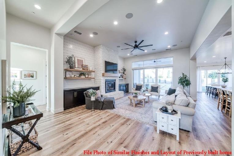 14480 Academy Oaks Lane Clovis, CA 93619 - Photo 21 of 37 a living room with fireplace furniture and a large window