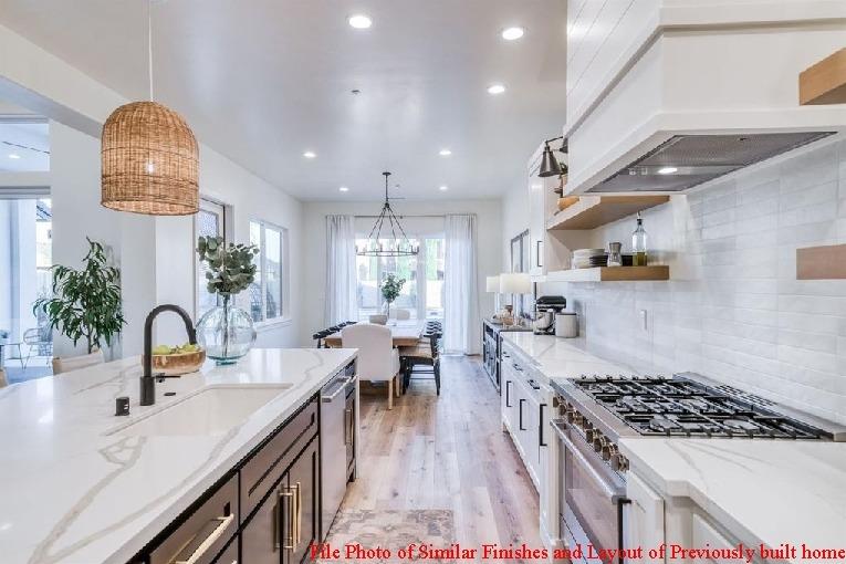 14480 Academy Oaks Lane Clovis, CA 93619 - Photo 24 of 37 a kitchen with counter top space a sink stainless steel appliances and cabinets