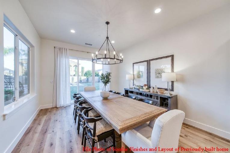 14480 Academy Oaks Lane Clovis, CA 93619 - Photo 27 of 37 a view of a dining room with furniture window and wooden floor