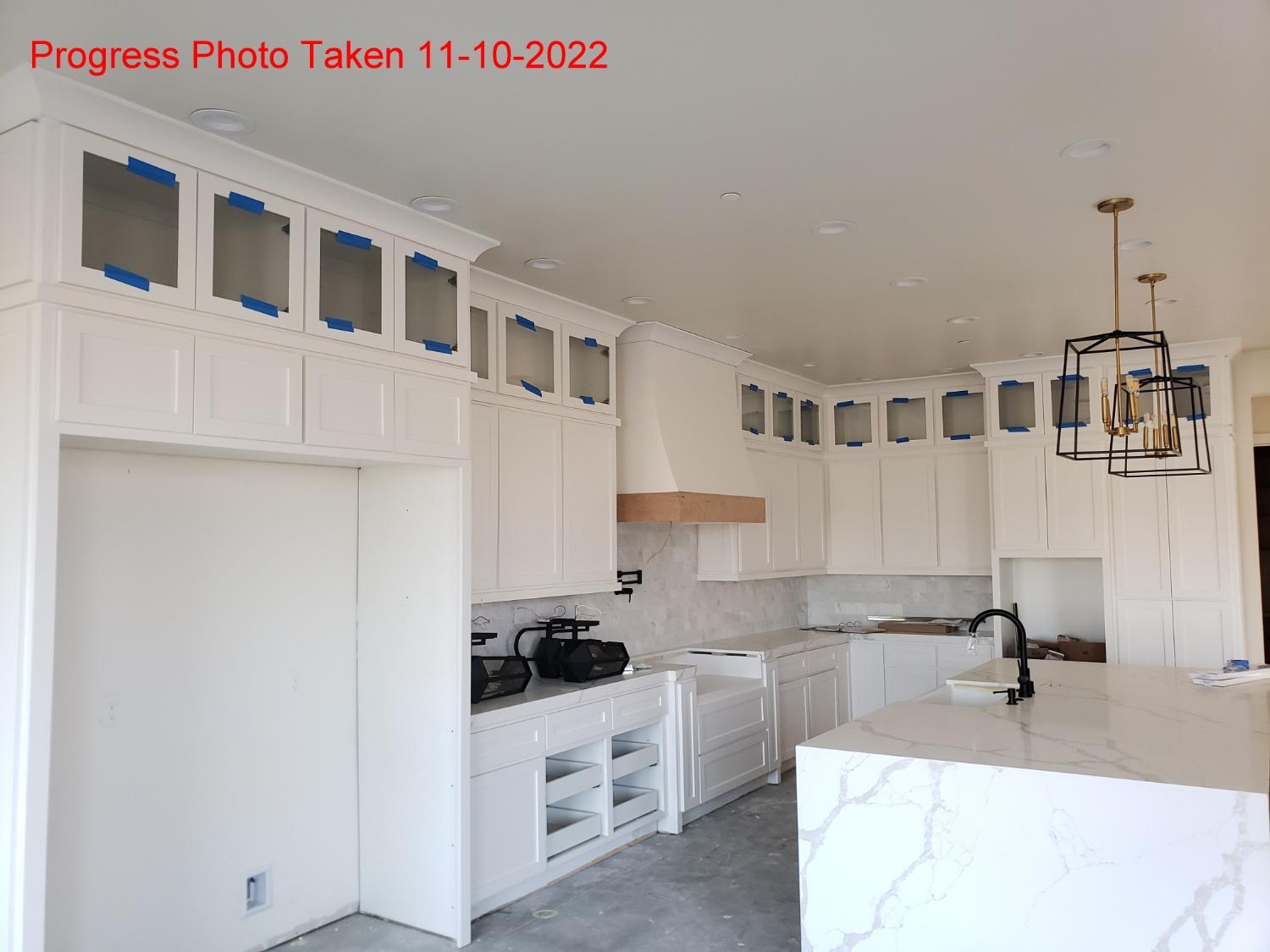 14480 Academy Oaks Lane Clovis, CA 93619 - Photo 3 of 37 a kitchen with stainless steel appliances a sink a stove a refrigerator and white cabinets