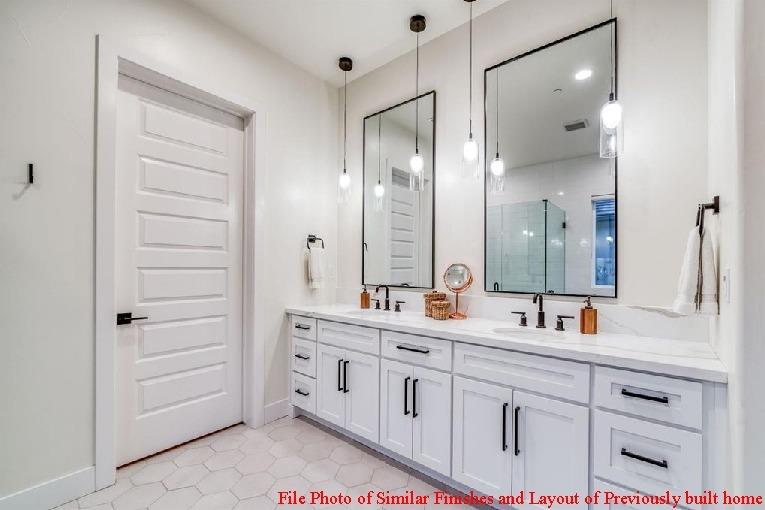 14480 Academy Oaks Lane Clovis, CA 93619 - Photo 35 of 37 a bathroom with a double vanity sink mirror and double